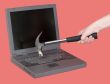 Laptop and hand with hammer