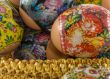 the easter decorated eggs lying in a wattled basket. macro shoot