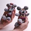 Cute small toys in hands