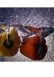 Fresh vegetables immersed in clear water.