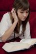  female teenager reads book