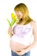 pregnant woman with yellow tulips