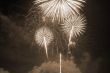 Fireworks lighting up the sky sepia