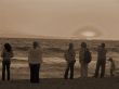 People watching Sunset sepia