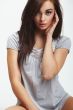 brunette wearing grey fashion dress on white isolated background