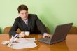 Businessman on a workplace with the laptop