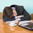Businessman has fallen asleep sitting at meeting