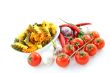 multicolored pasta, pepper, tomato and garlic