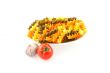 multicolored pasta, one tomato and garlic