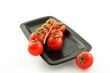 tomatoes bunch on a black plate
