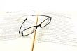 glasses on open book