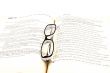 glasses on open book