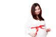 Pregnant woman with red bow
