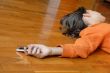 Teen girl lying on floor