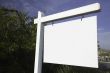 Blank Real Estate Sign in Neighborhood