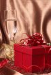 Red gift box with bows and stars