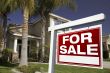 For Sale Real Estate Sign and House
