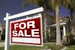 For Sale Real Estate Sign and House