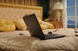 laptop on a bed
