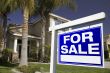 For Sale Real Estate Sign and House