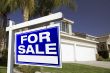 For Sale Real Estate Sign and House