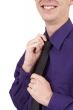 Businessman fixing his tie