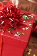 Red gift box with bows and stars