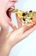 Girl is eating pizza