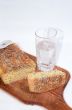 Cutting bread and glass of mineral water