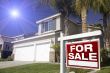 Red For Sale Real Estate Sign and House