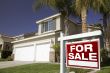 Red For Sale Real Estate Sign and House