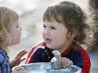 Two boys by the drinking fountain