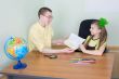 Girl shows new drawing to the brother