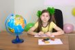 Girl sitting at a table with plasticine