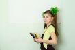 Girl with color pencils and a sheet of paper