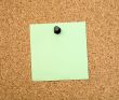 Stickers pinned to a cork board