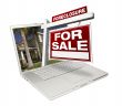 Foreclosure Home for Sale Real Estate Sign & Laptop