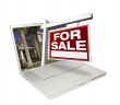 Home for Sale Sign & New Home on Laptop