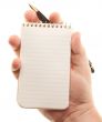 Male Hands Holding Pen and Pad of Paper
