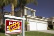 Red Sold For Sale Real Estate Sign and House