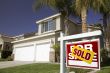 Red Sold For Sale Real Estate Sign and House