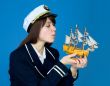 Girl blowing on sails