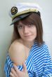Beautiful girl in a stripped vest and cap
