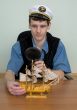 Man in uniform cap with sailer