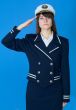 Girl in a sea uniform salutes