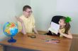 Girl shows new drawing to the brother