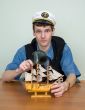 Man in uniform cap with sailer