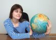 Woman in a stripped vest with globe
