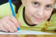 Girl holding a blue pencil