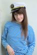 Girl in a cap and a stripped vest